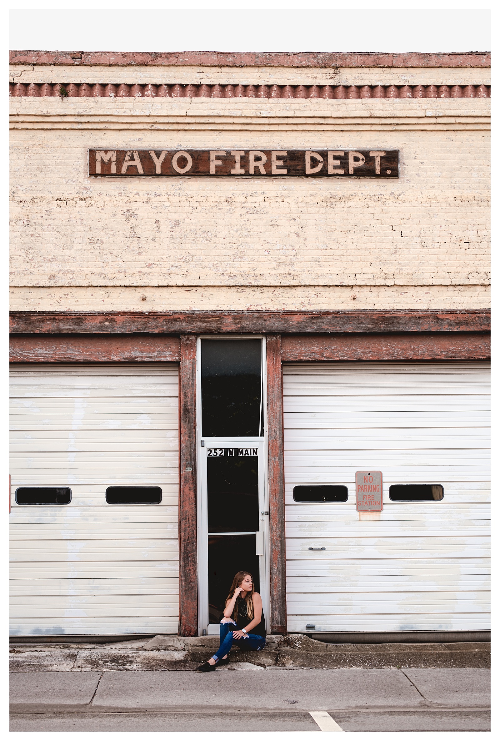 Senior photos with old rustic firehouse. Shelly Williams Photography