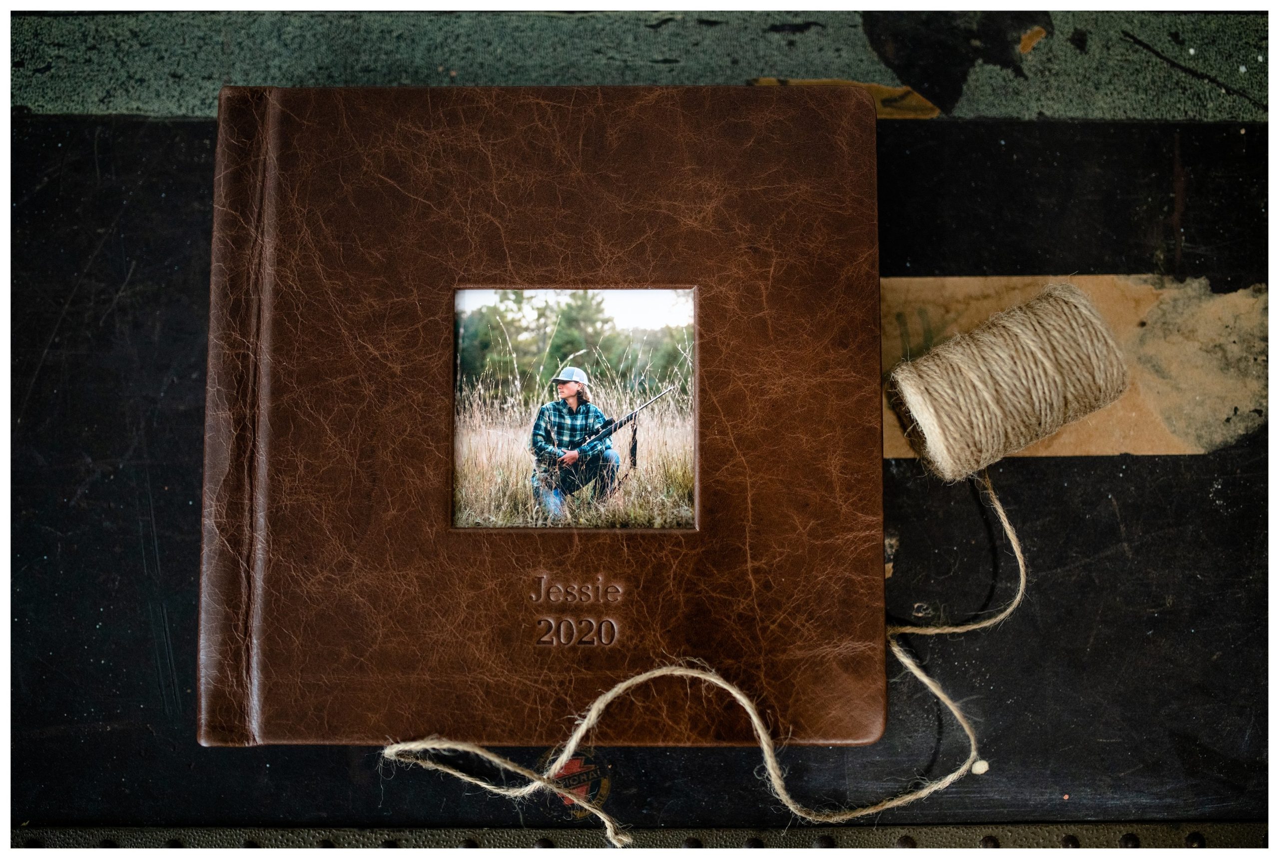 Professional photo album made with luxury distressed leather for a high school senior.