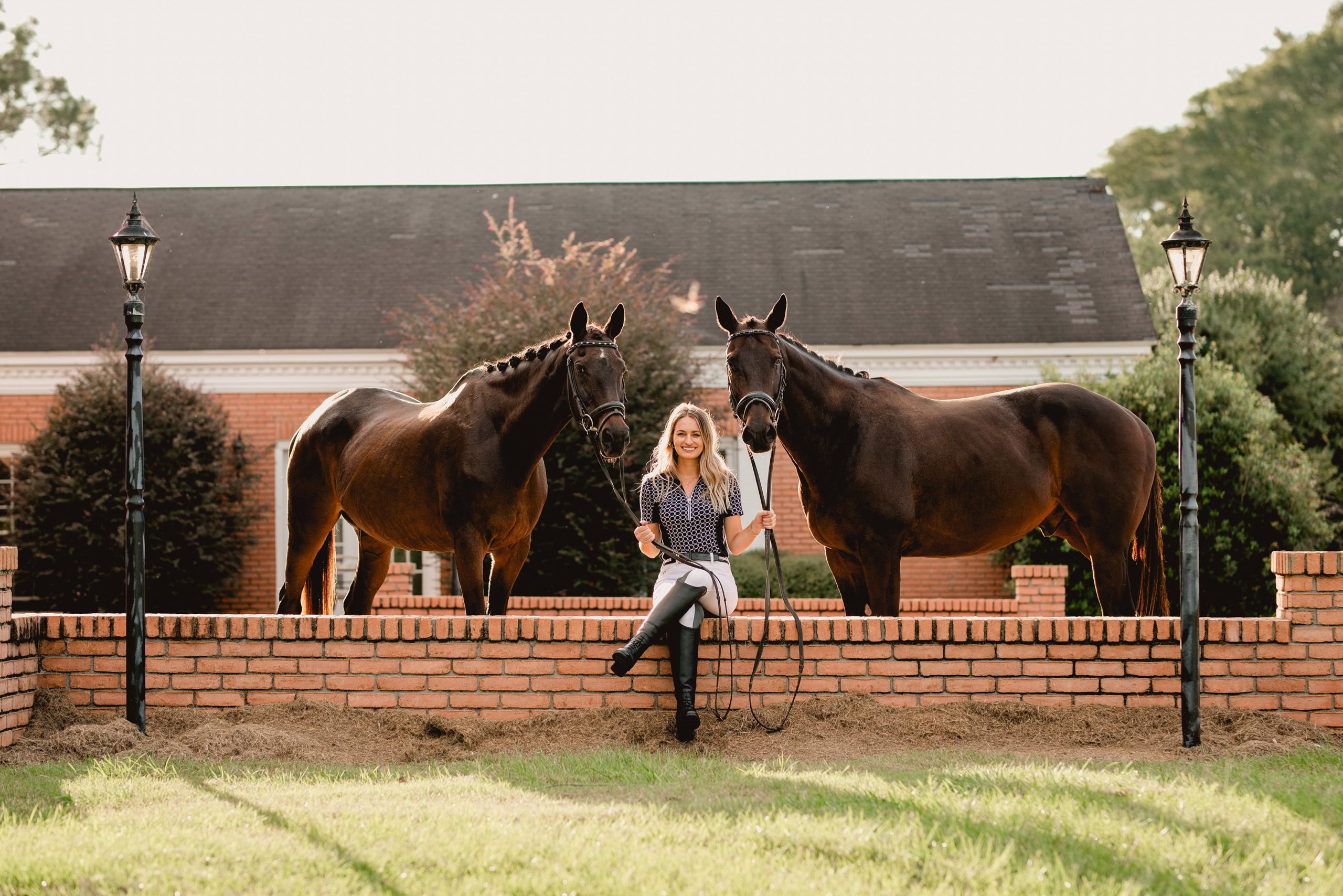 Northwest Florida horse photographer and girl with two horses infront of brick home.