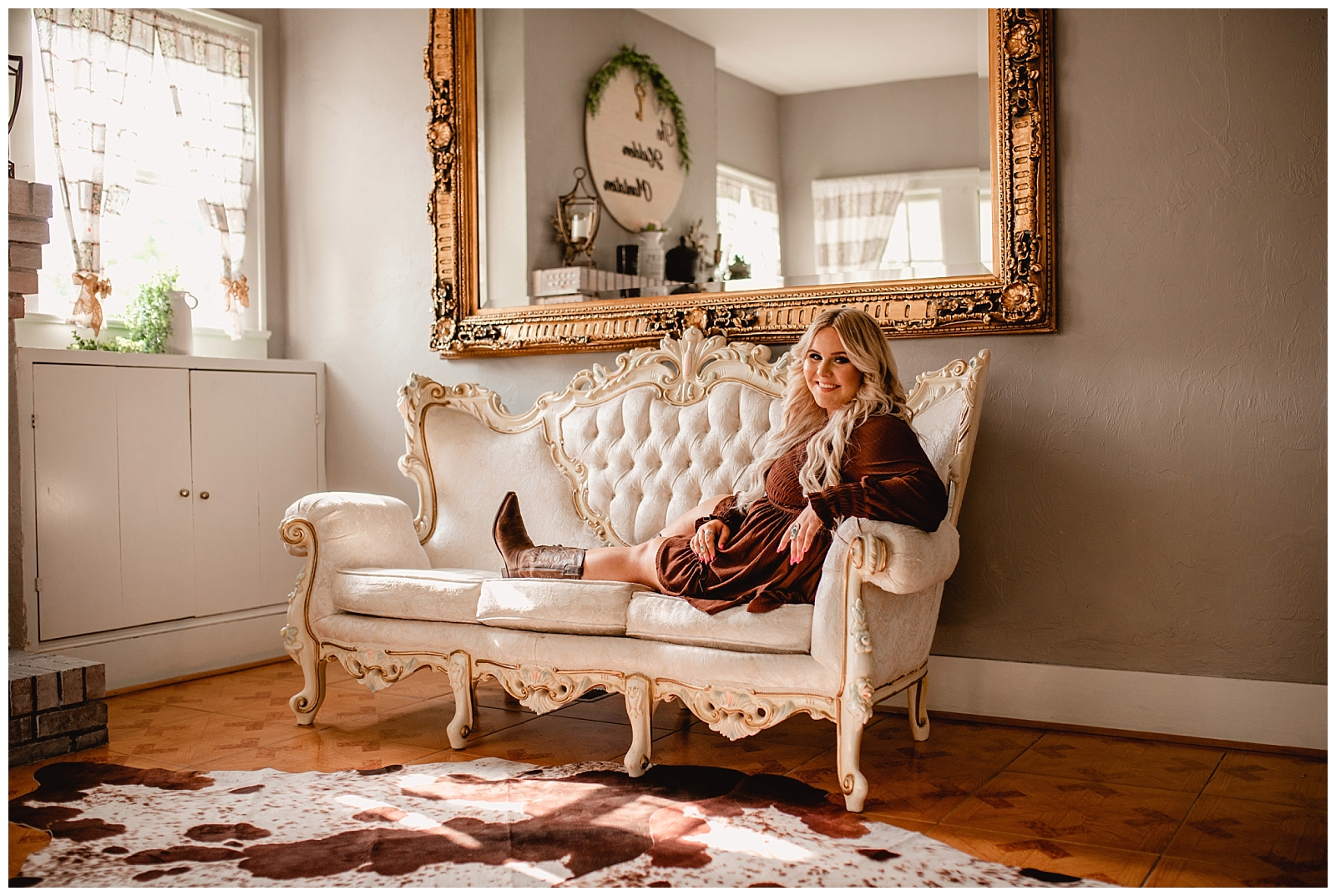 Southern senior pictures with cow hide rug and cowboy boots. North FL Senior Photographer.
