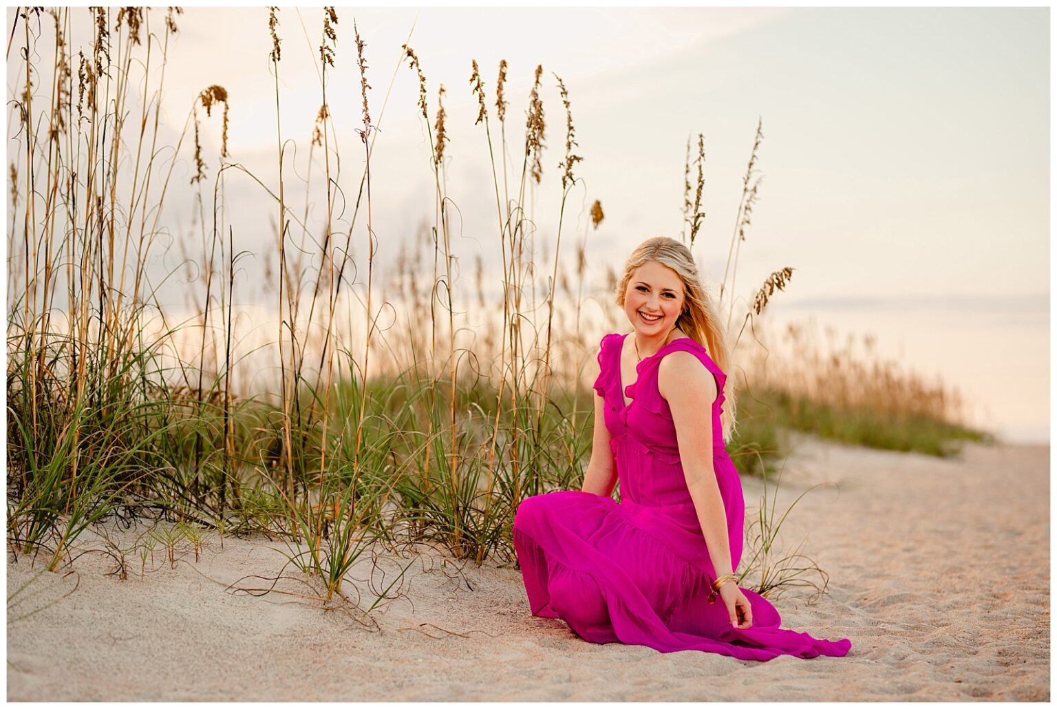 Posing ideas for senior pictures on the beach. Senior Photographer in St Augustine, Florida. Old Town Senior Photographer. Hot pink outfit.