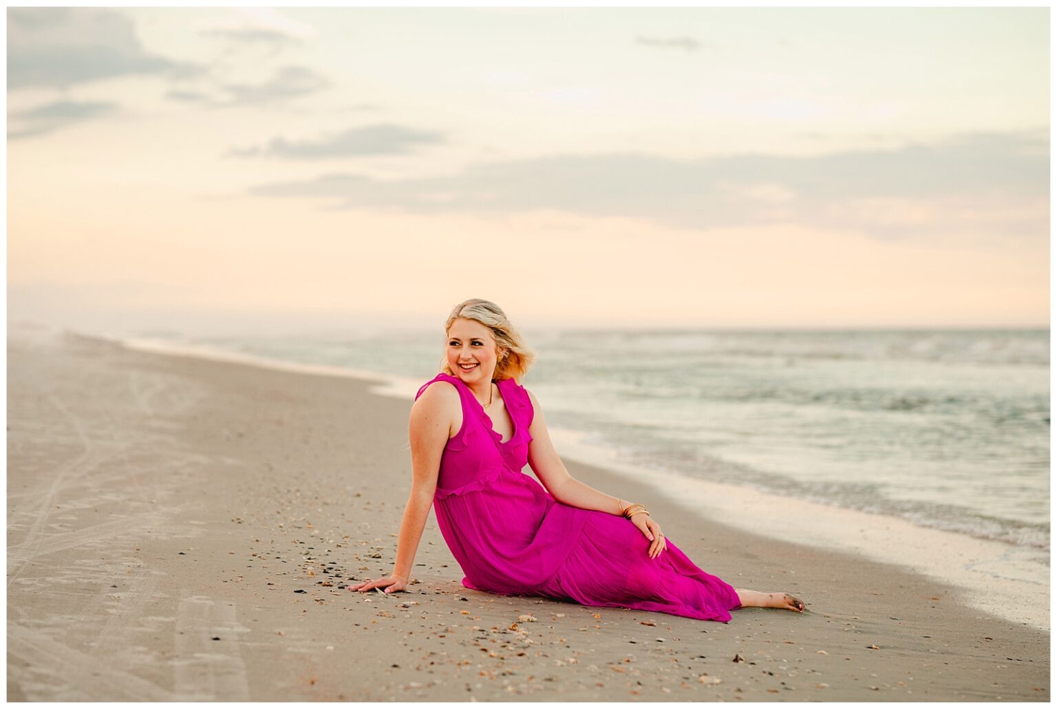 Posing ideas for senior pictures on the beach. Senior Photographer in St Augustine, Florida. Old Town Senior Photographer. Hot pink outfit.