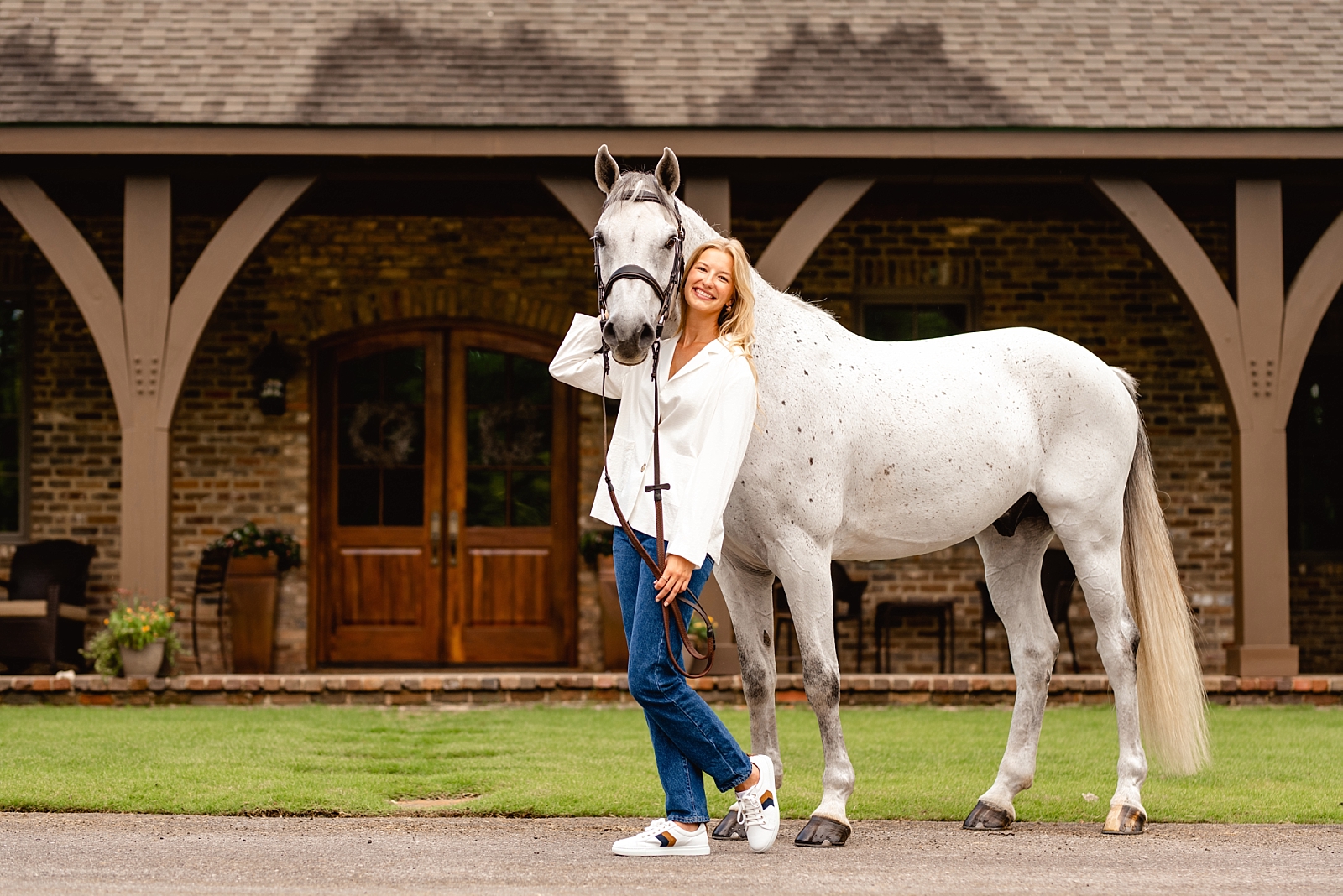 Horse photographer near Birmingham, Alabama takes photos of Dutch Warmblood and his rider at a high-end hunter/jumper facility outside of Bham.