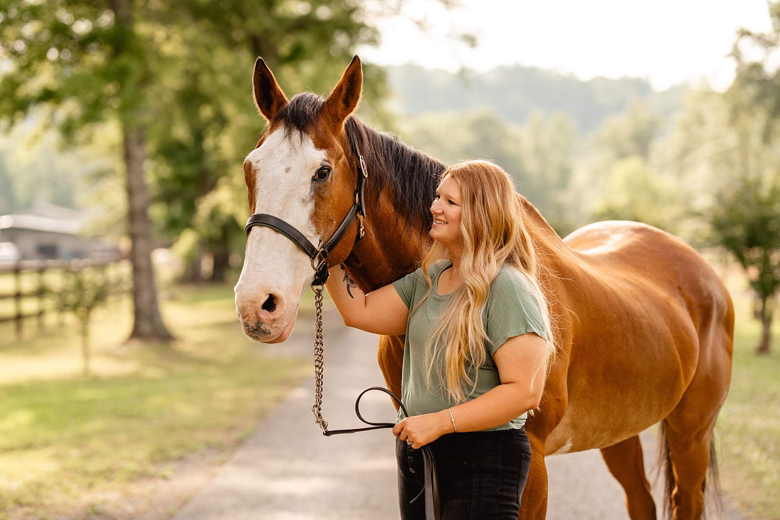 Equestrian photographer in Alabama. Woman with her first horse with the Alabama mountains in the background.