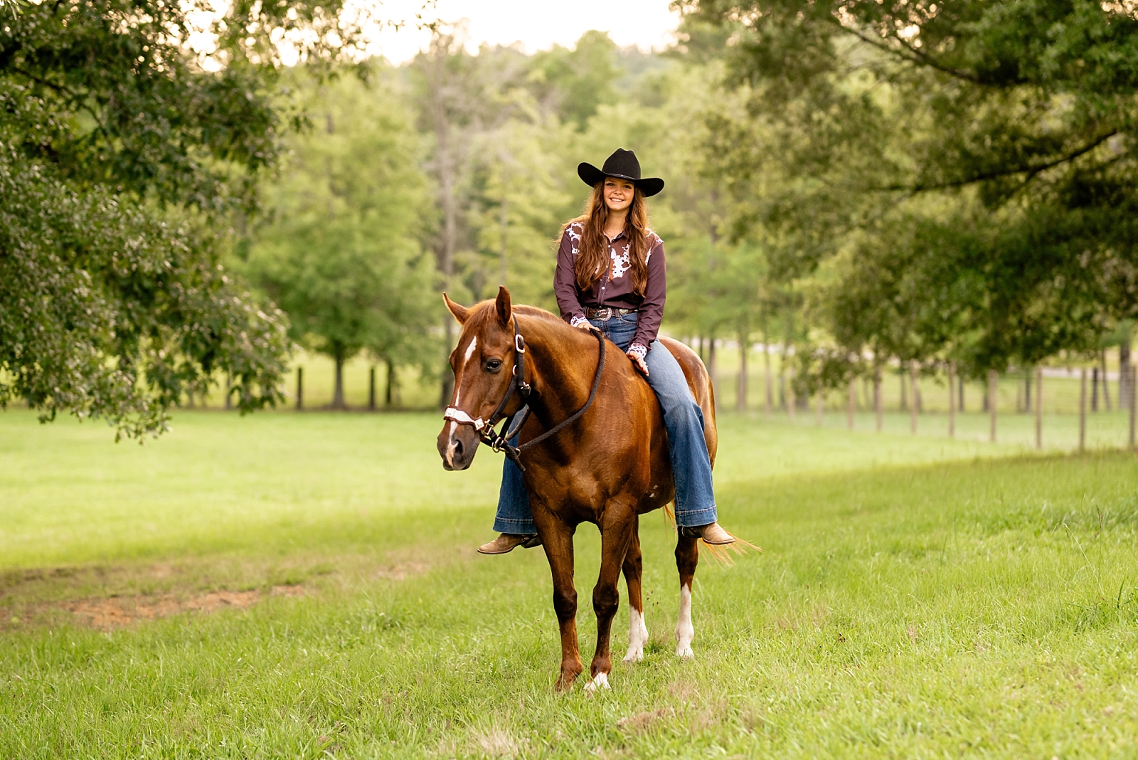 Barrel racing horse and rider take photos with professional equine photographer while bareback in a field.
