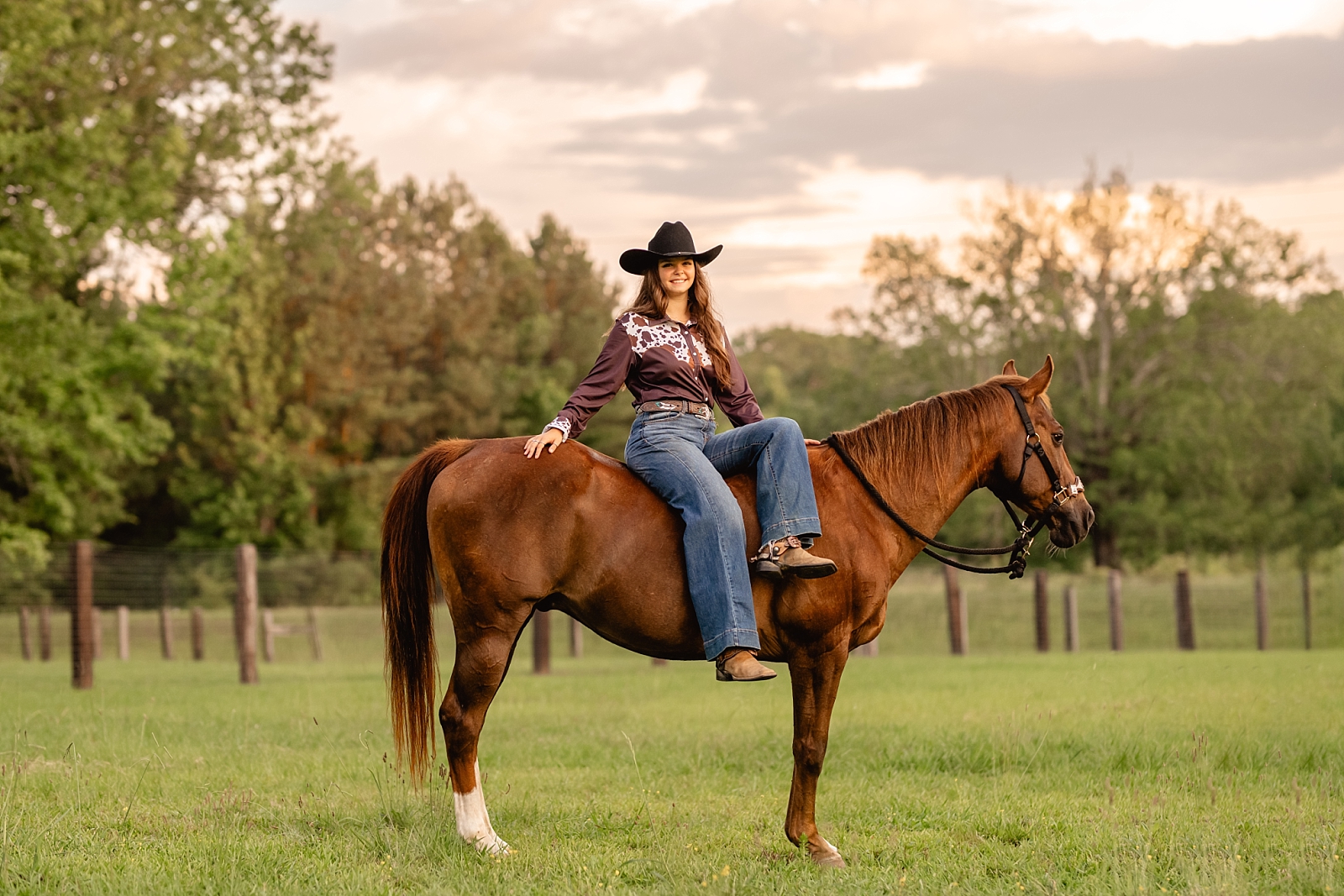 Barrel racing horse and rider take photos with professional equine photographer while bareback in a field.