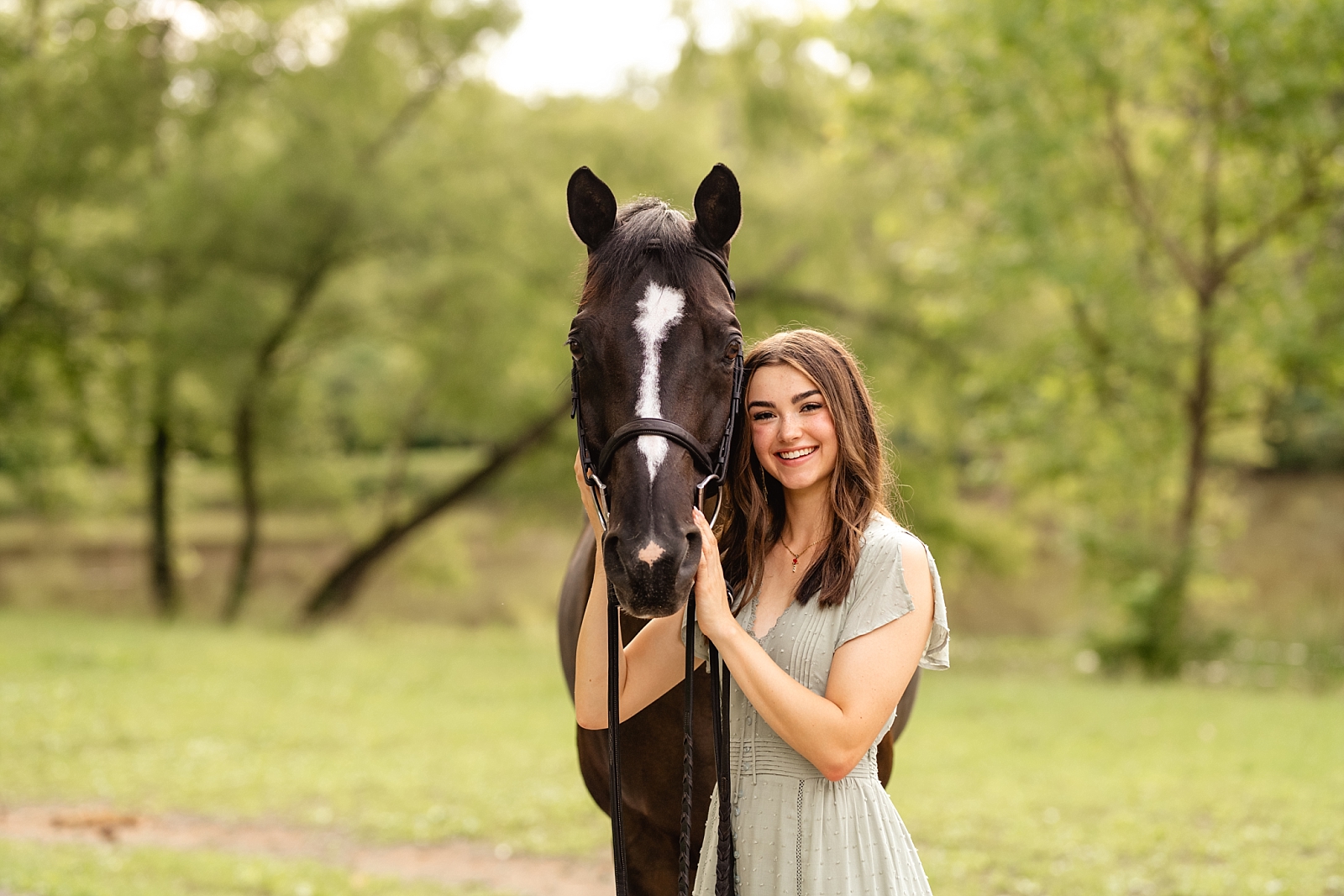 Alabama Hunter Jumper Association member has photos taken with her horse at Fox Lake Farm in Birmingham, Alabama.