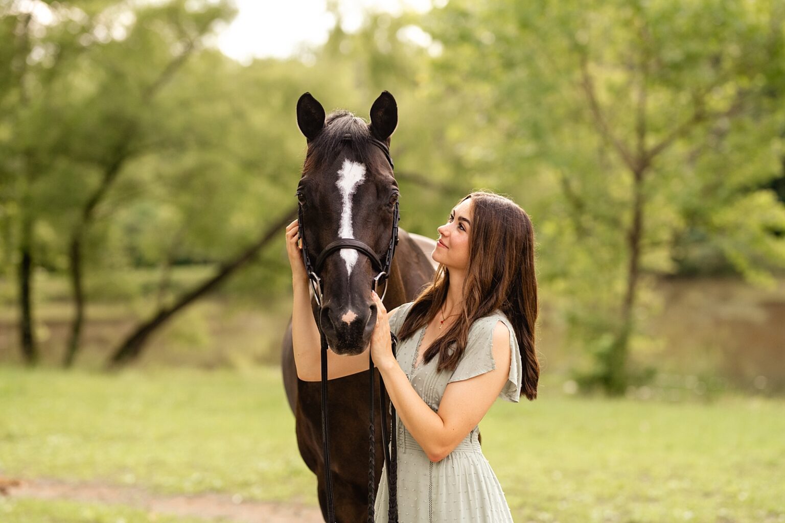 Alabama Hunter Jumper Association member has photos taken with her horse at Fox Lake Farm in Birmingham, Alabama.