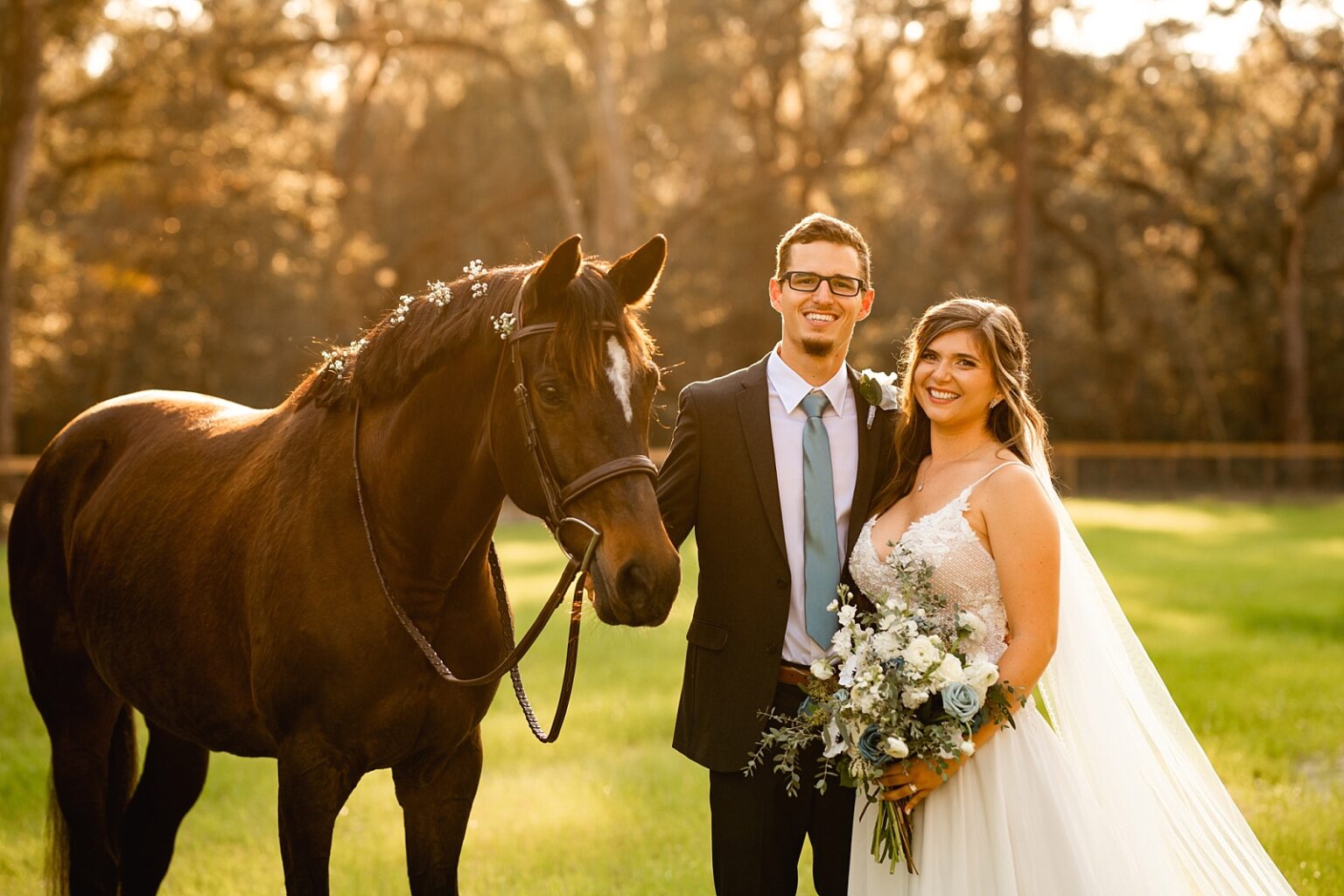 Wedding ideas with horses. Babys breath in horses mane. Bride and groom take photos with horse during sunset.