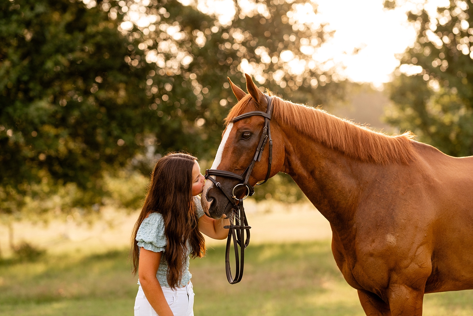 Equine photographer near Tuscaloosa, Alabama takes horse and rider portraits of girl in white dress with her Thoroughbred who compete with the Alabama Eventing Team.