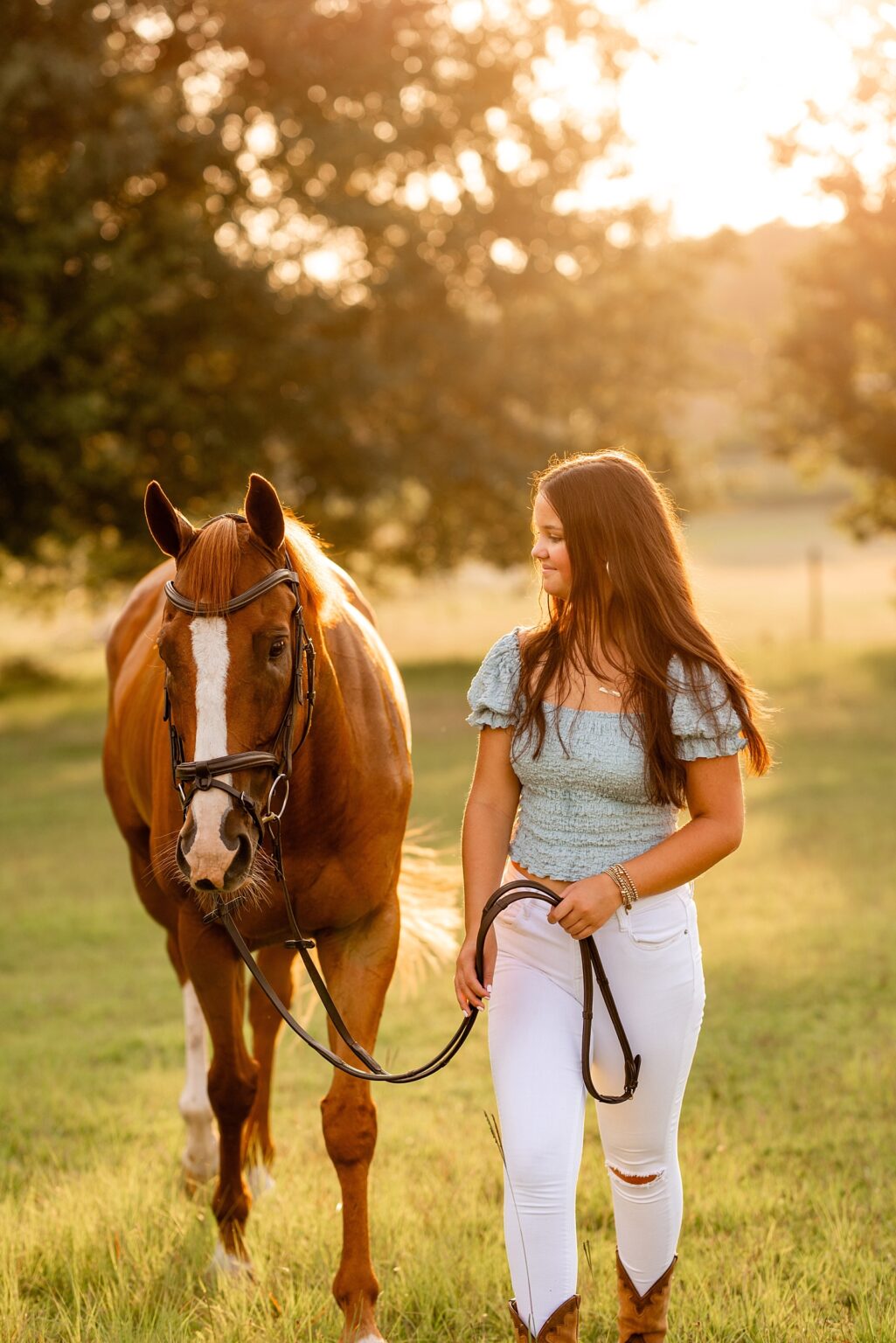 Equine photographer near Tuscaloosa, Alabama takes horse and rider portraits of girl in white dress with her Thoroughbred who compete with the Alabama Eventing Team.