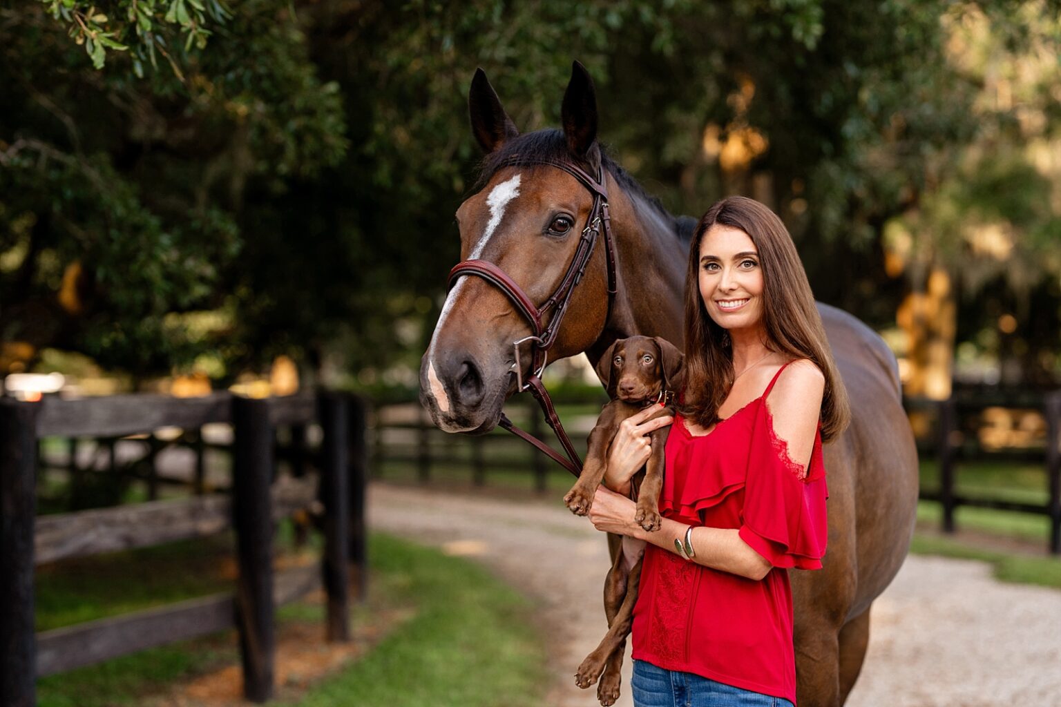 Horse and rider photoshoot with puppy in Tallahassee with casual outfit with red top and jeans. What to wear for equestrian photoshoot.