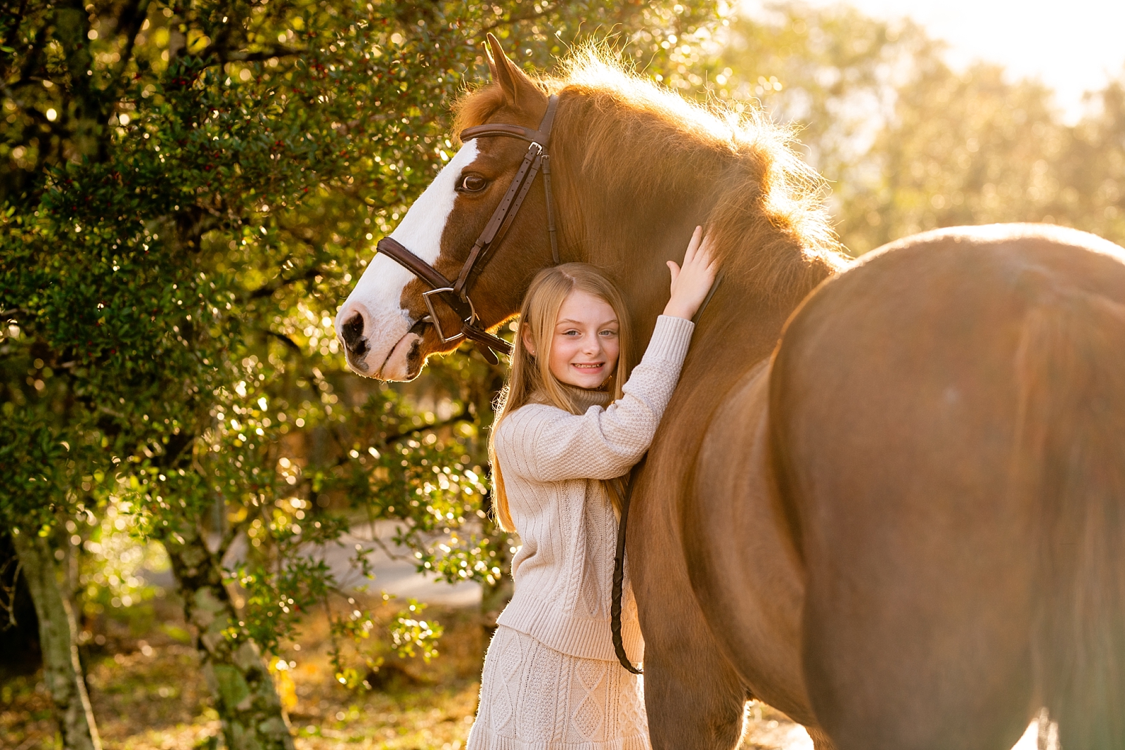Equestrian family photography. Family photos with horses. Girl and her pony. Winter equine photoshoot.
