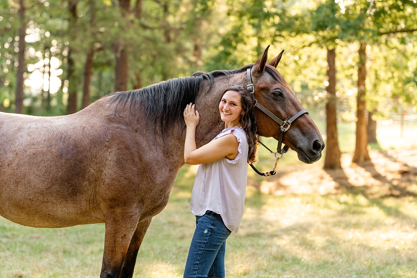 Alabama horse portrait photographer takes photos at sunset of woman with her heart horse. Quarter Horse Gelding.