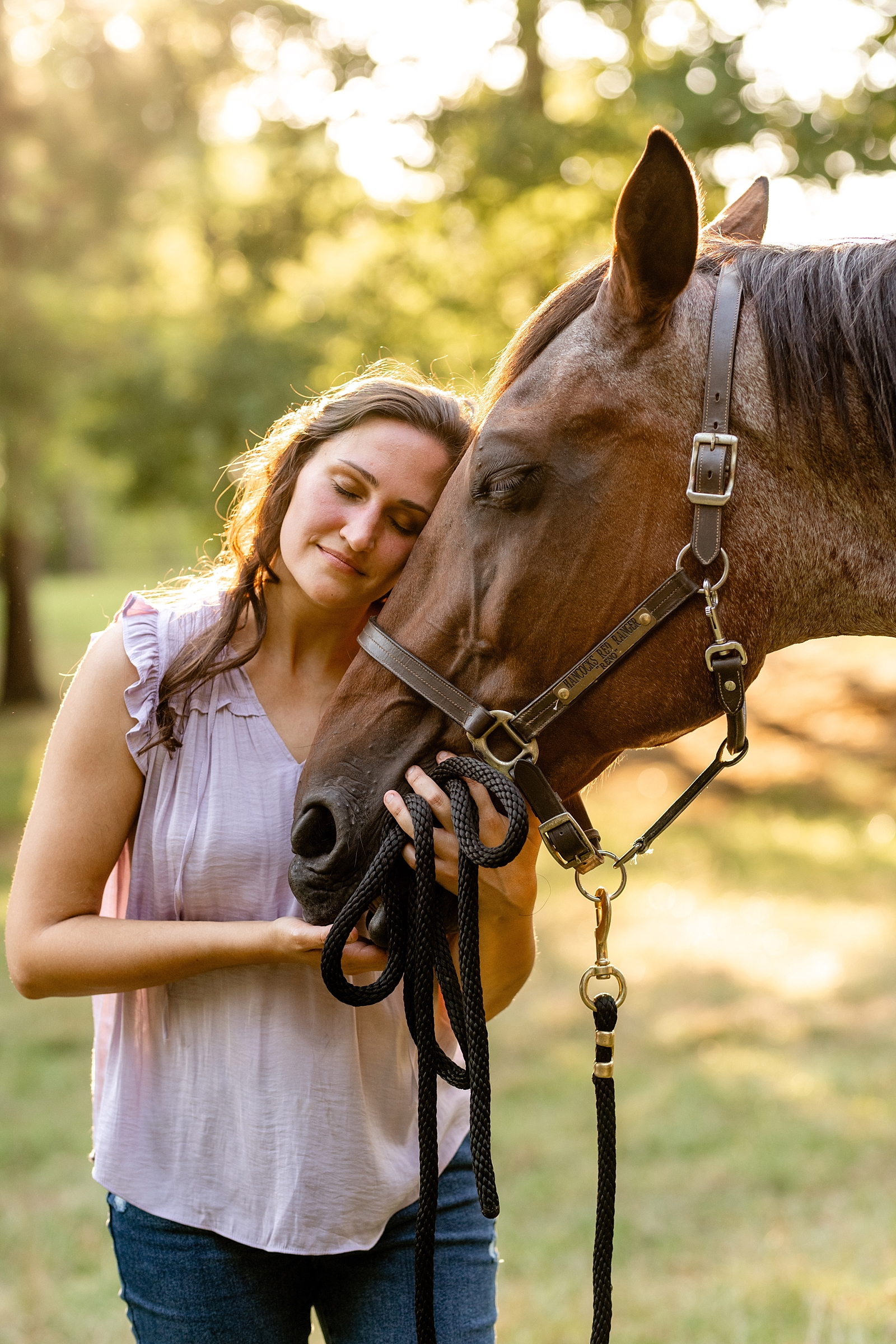 Alabama horse portrait photographer takes photos at sunset of woman with her heart horse. Quarter Horse Gelding.