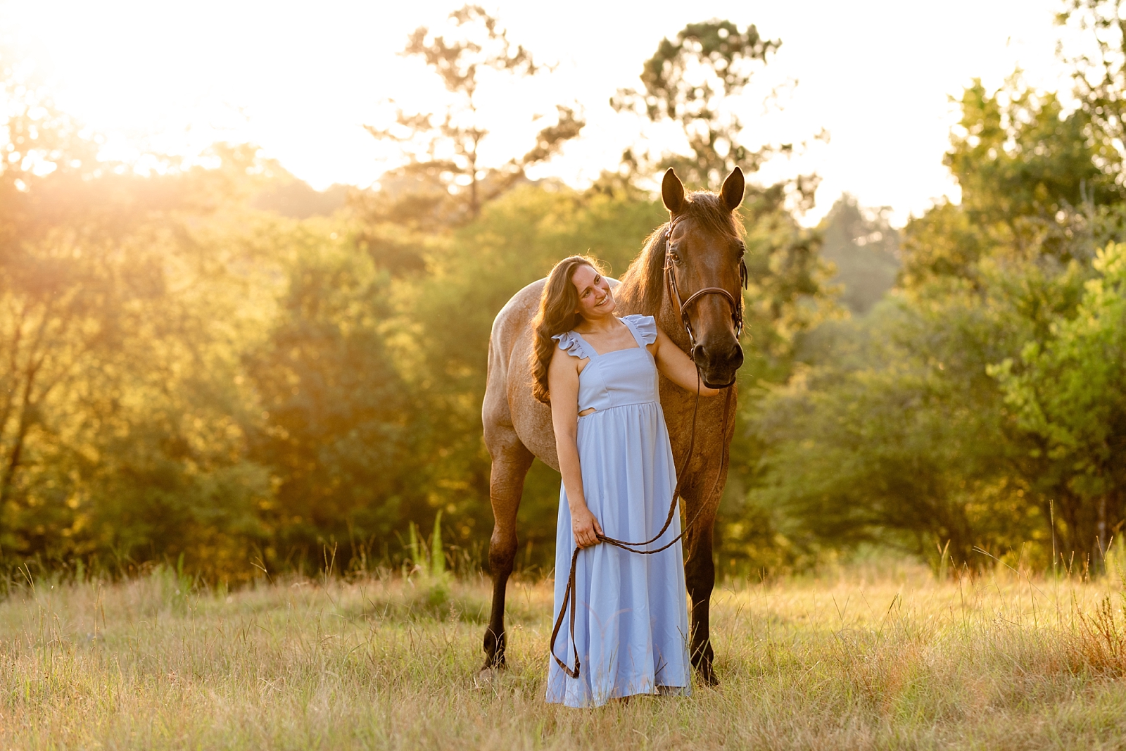 Alabama horse portrait photographer takes photos at sunset of woman with her heart horse. Quarter Horse Gelding.