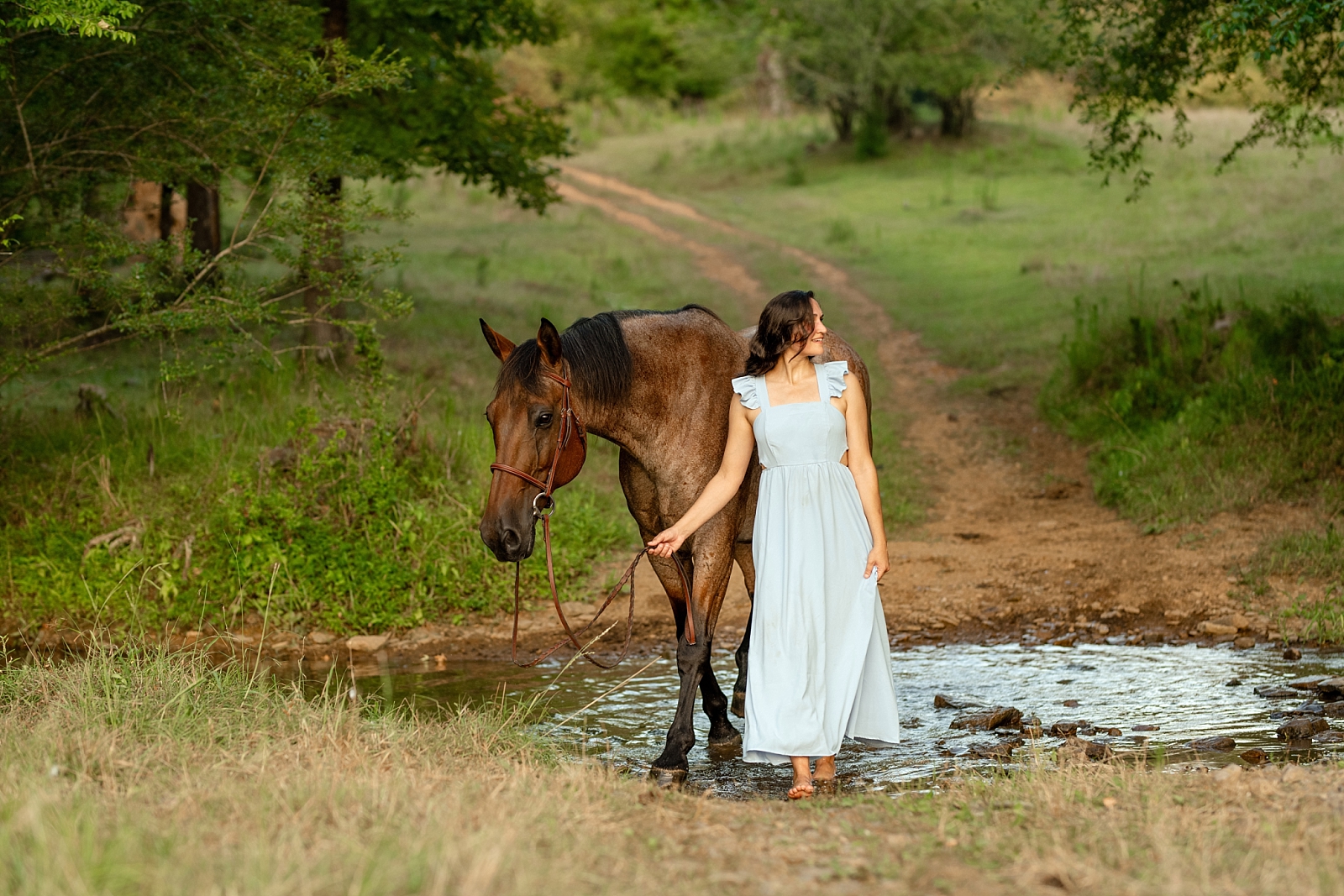 Alabama horse portrait photographer takes photos at sunset of woman with her heart horse. Quarter Horse Gelding.