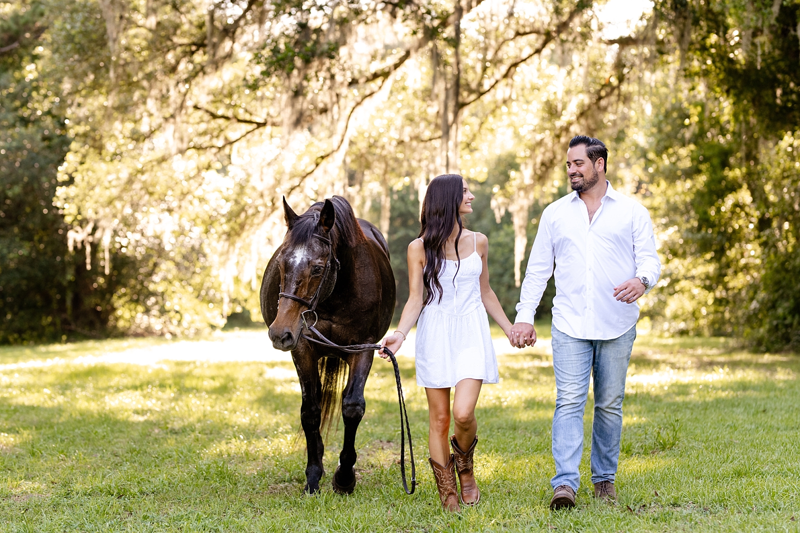 Engagement photos with your horse. North Florida oak trees. Hunter jumper horse. Girl with her horse in white dress.