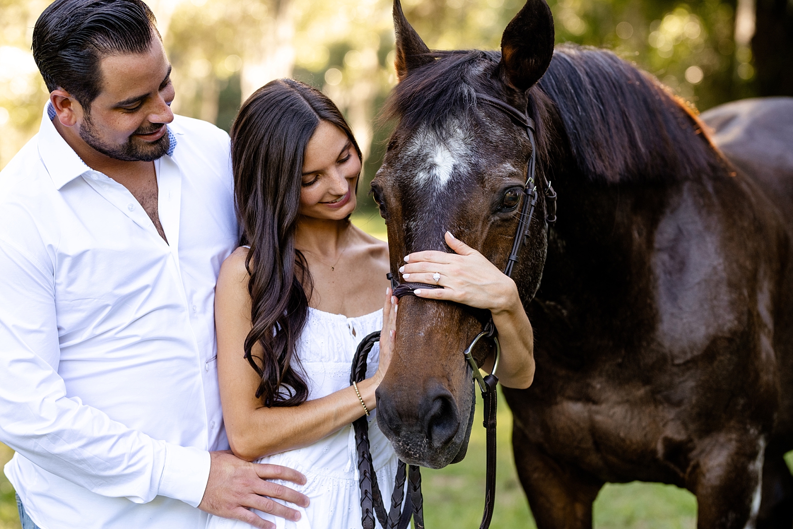 Engagement photos with your horse. North Florida oak trees. Hunter jumper horse. Girl with her horse in white dress.