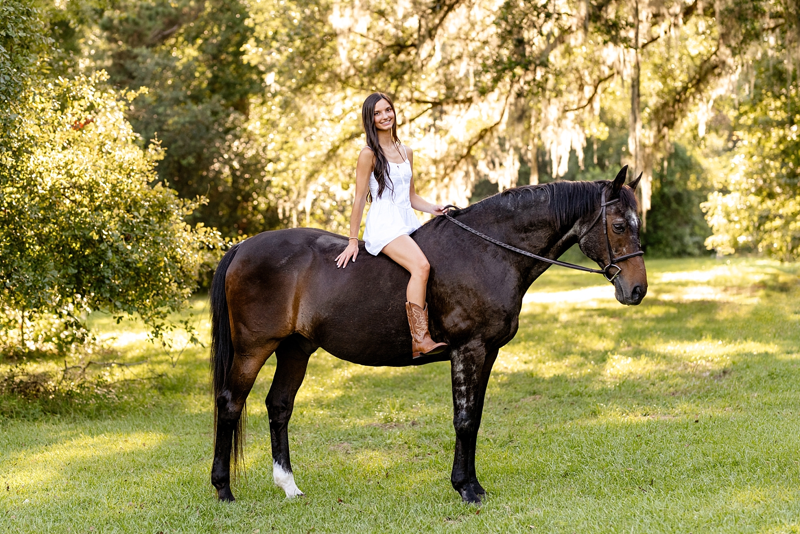 Photos of girl and her horse at Cavallo Farms in Tallahassee, FL. Beautiful oak trees. Posing ideas for girl in white dress with her horse.