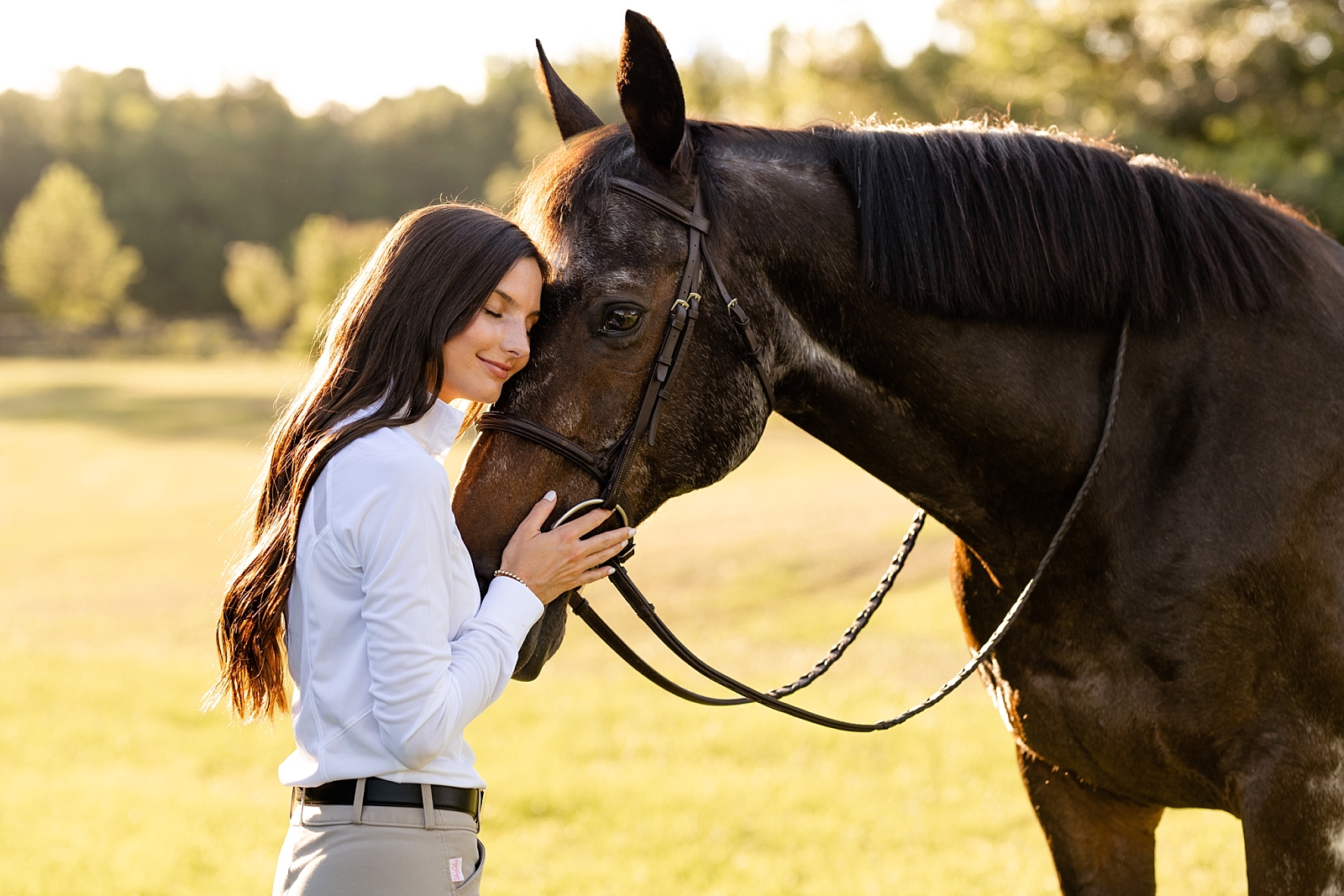 Photos of girl and her horse at Cavallo Farms in Tallahassee, FL. Beautiful oak trees. Posing ideas for girl in riding breeches with her horse.