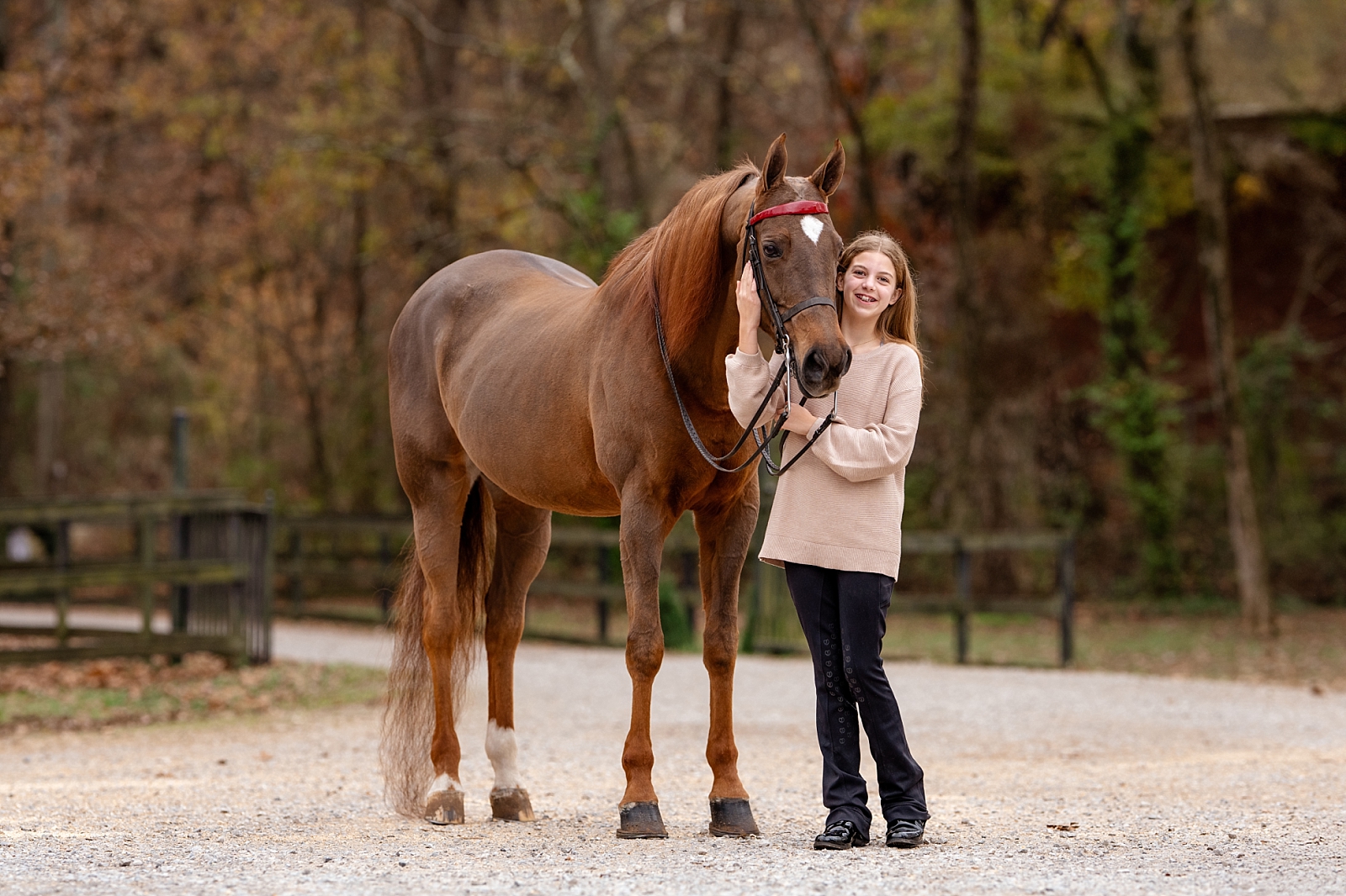 Sweet moment of Madelyn hugging her first horse, Clarice, during a portrait session in Alabama.