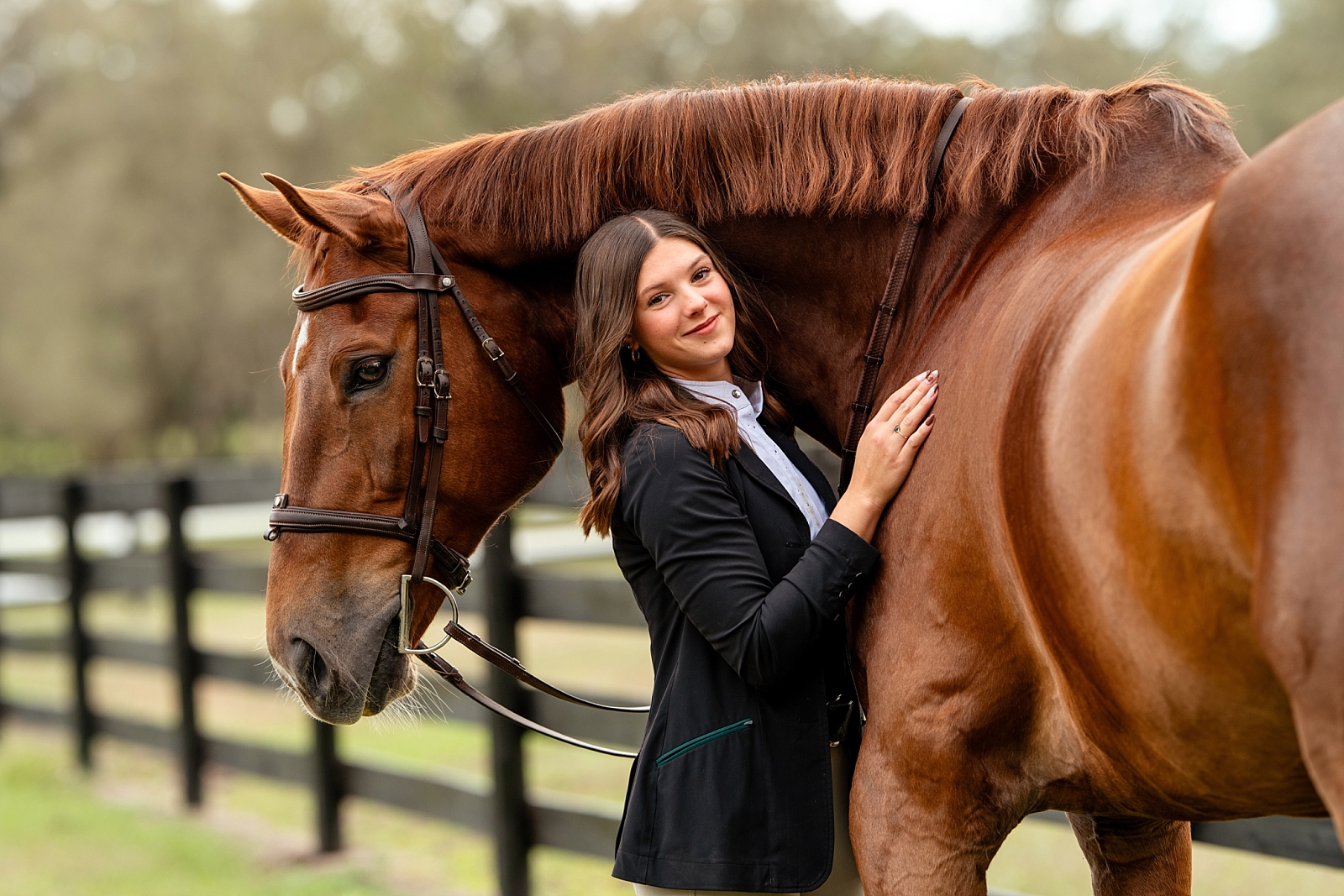 Noelle stands beside her horse Kistra during a golden hour equine photography session in Ocala, Florida.