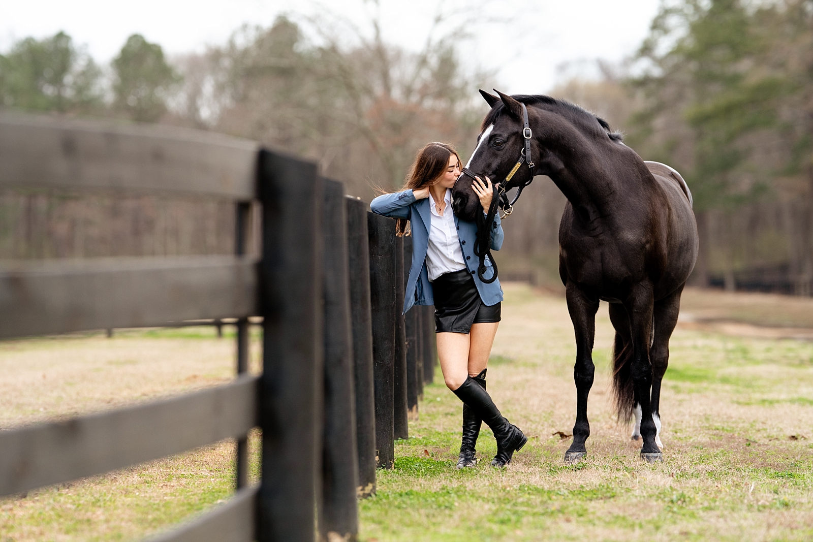 Holly poses with her gelding Kos during a horse and rider photo session in Birmingham, Alabama.