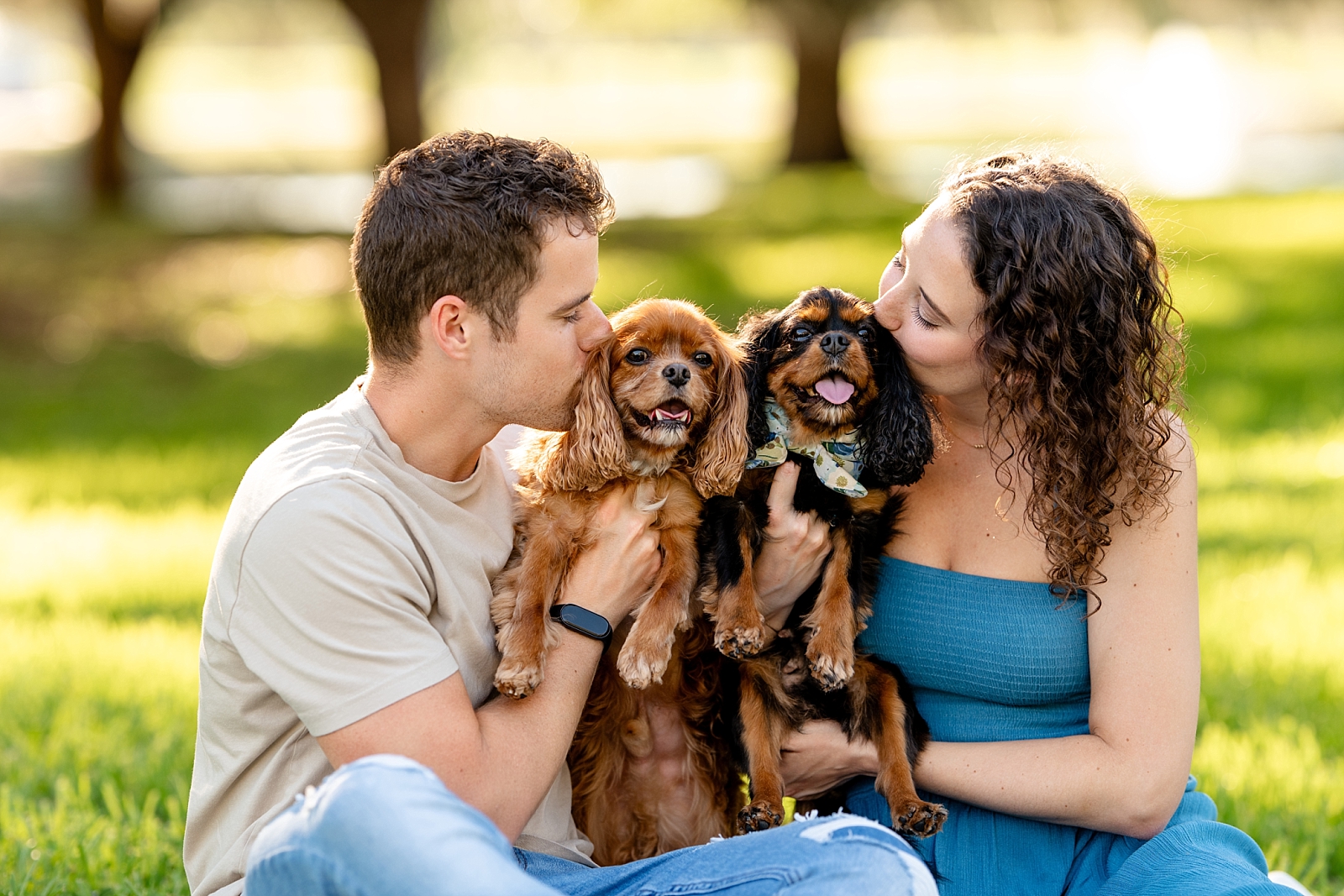 Katelyn and Josh pose with their Cavalier King Charles Spaniels, Felicity and Finley, during a couple and pet photography session.