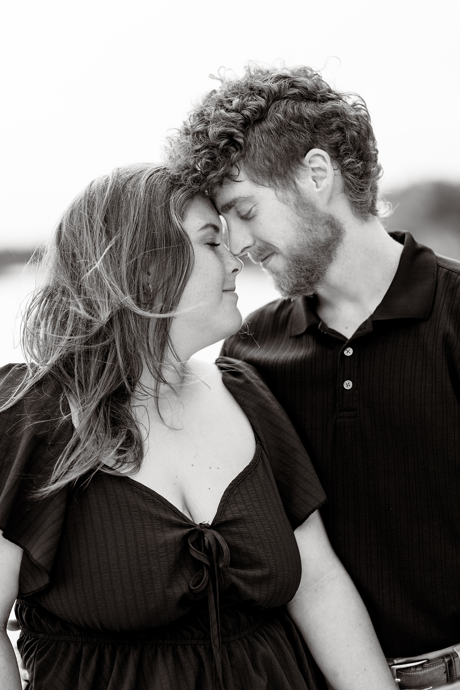 Kristen and Corey pose together in the gardens during their engagement session at Washington Oaks State Park.