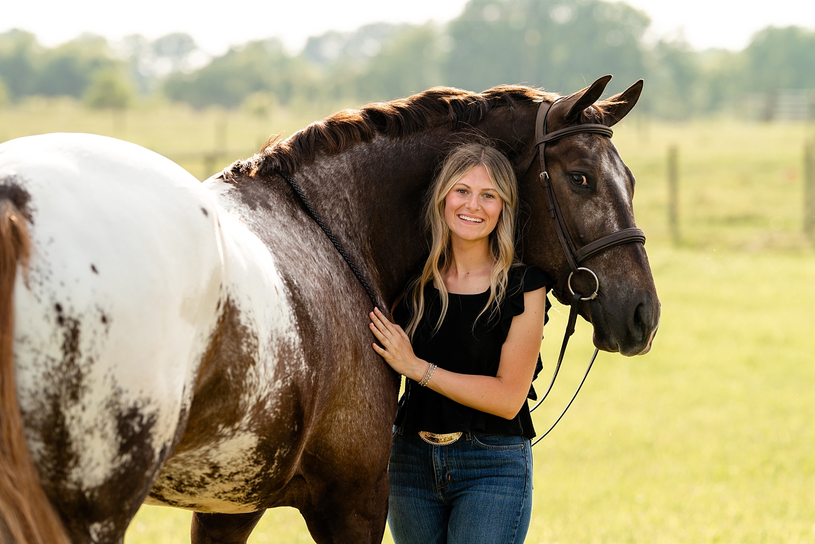Vivienne stands with her Appaloosa gelding Ted, her lease horse for Hunter Under Saddle at ApHC shows.